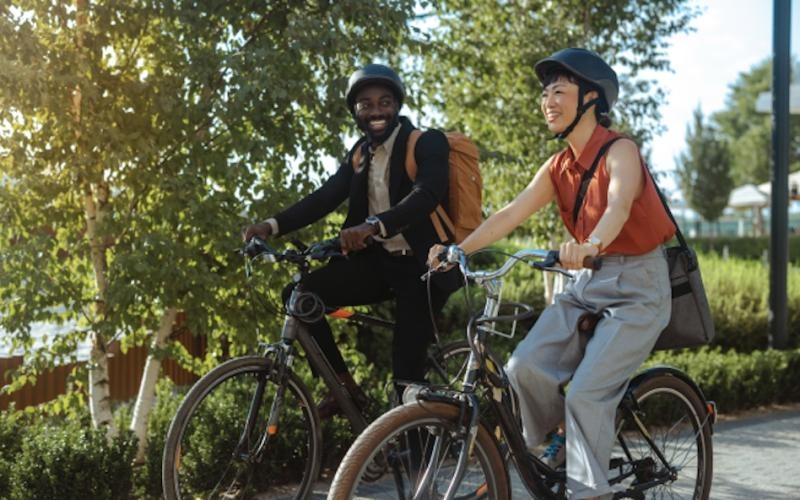 a couple of people riding bikes
