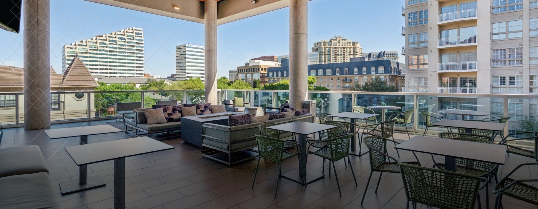 a patio with tables and chairs