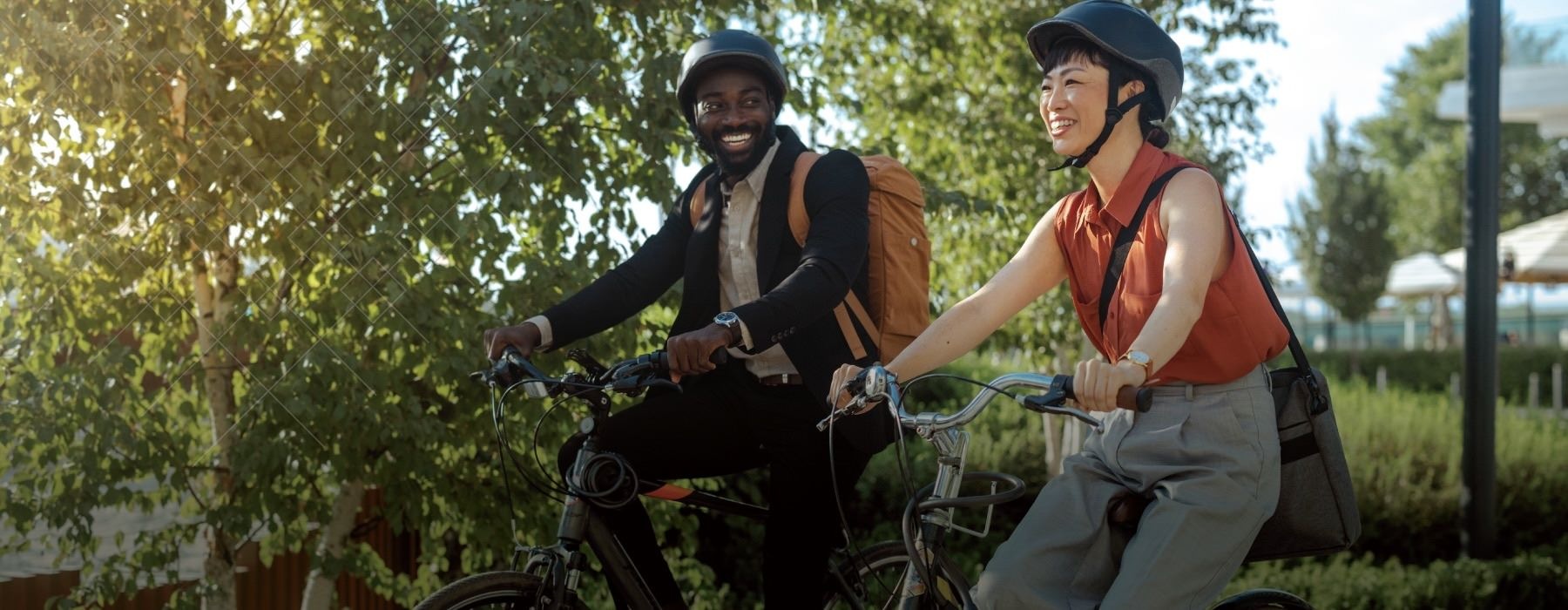 a man and woman riding bikes