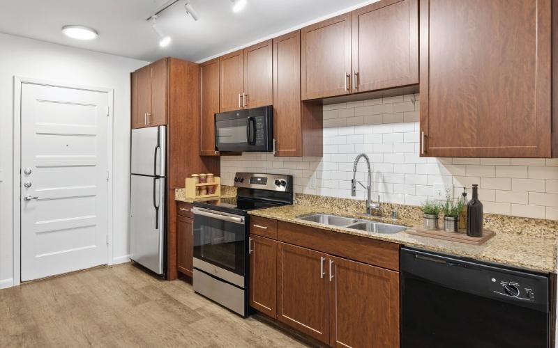 a kitchen with wooden cabinets