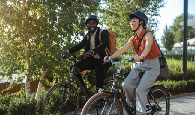 a couple of people riding bikes